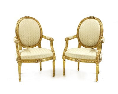 Lot 393 - A pair of Louis XVI style fauteuils