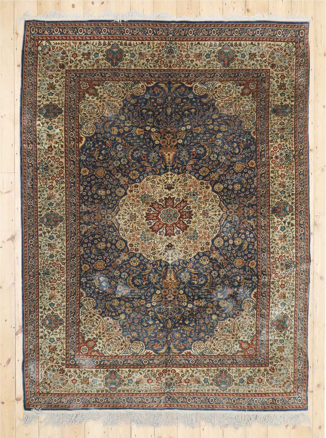 Lot 205 - A Persian silk rug