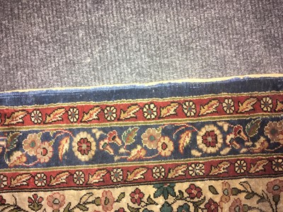 Lot 205 - A Persian silk rug