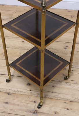 Lot 246 - A three-tier étagère occasional table