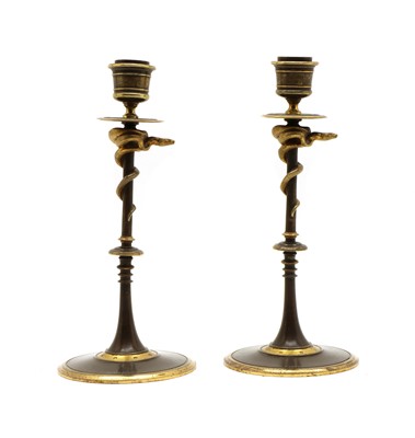 Lot 219 - A pair of serpent candle sticks by Ferdinand Barbedienne