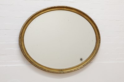 Lot 441 - A gilt-framed oval mirror