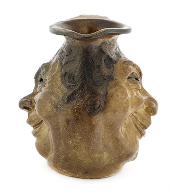 Lot 180 - A Martin Brothers stoneware double face jug