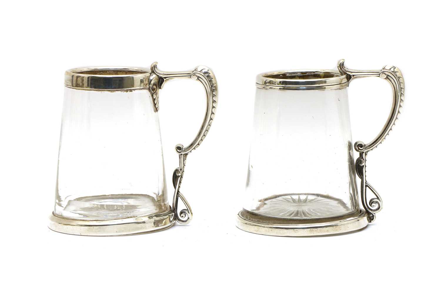 Lot 3 - A pair of Victorian silver mounted glass tankards