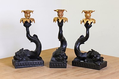Lot 240 - A set of three rococo-style composite and gilt-metal candleholders