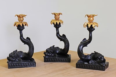 Lot 240 - A set of three rococo-style composite and gilt-metal candleholders