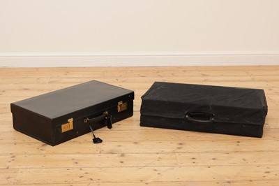 Lot 38 - Two graduated black leather suitcases by Tanner Krolle