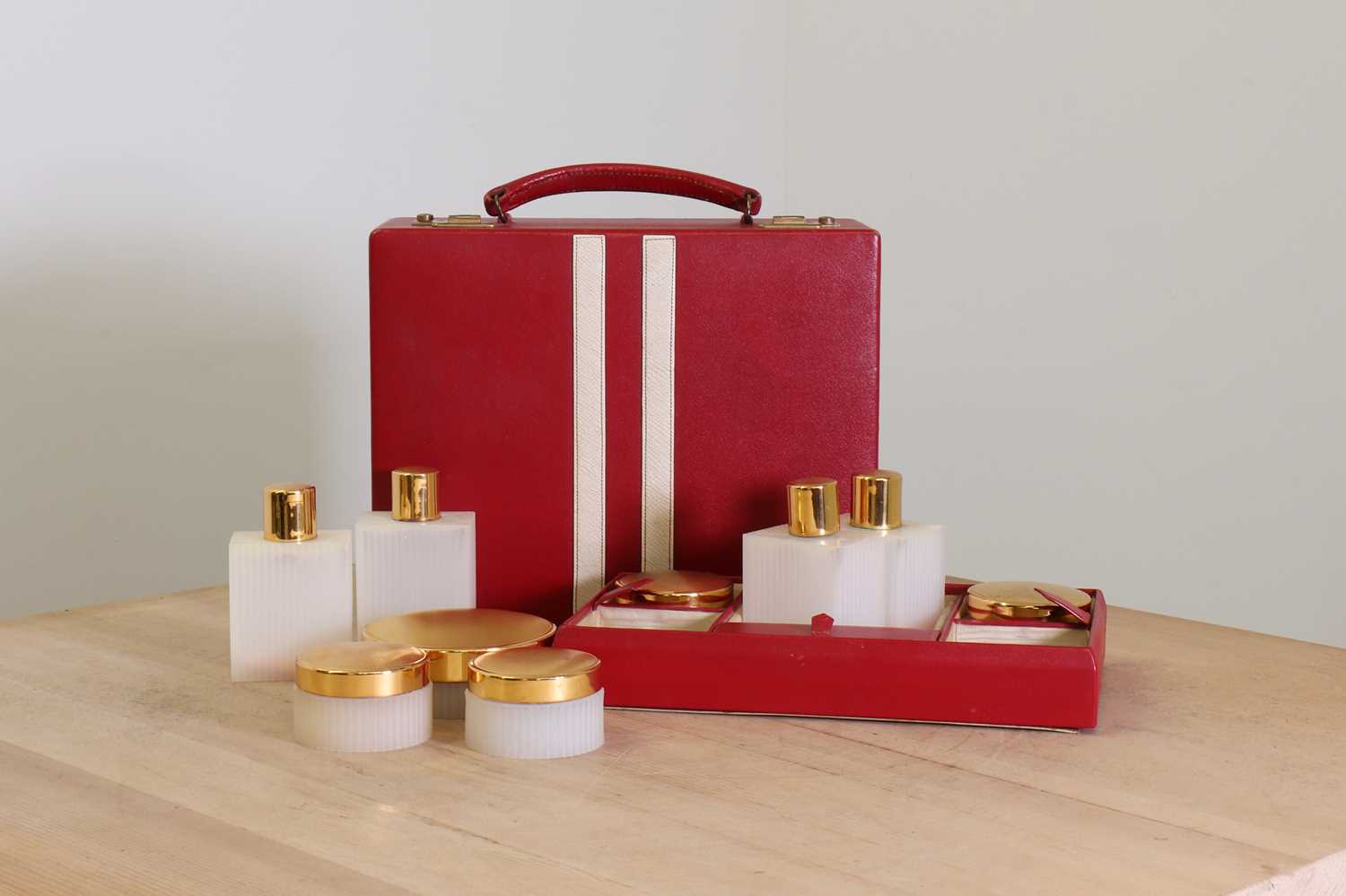 Lot 38 - A red leather vanity case by Asprey London