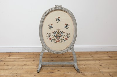 Lot 755 - A grey-painted and needlework fire screen