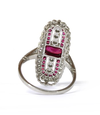 Lot 1141 - A platinum ruby and diamond fingerline cluster ring