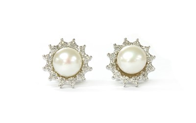 Lot 1263 - A pair of 18ct white gold cultured freshwater pearl and diamond cluster earrings