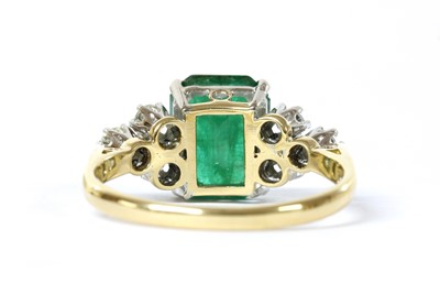 Lot 1193 - A gold emerald and diamond ring