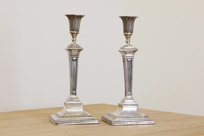 Lot 636 - A pair of George III silver table candlesticks