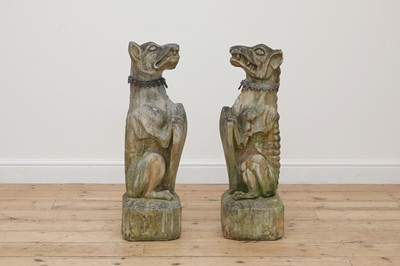 Lot 841 - A near pair of composite stone guardian dogs