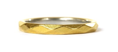 Lot 1111 - A 22ct gold faceted wedding ring