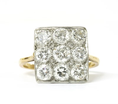 Lot 1069 - A diamond set square cluster ring
