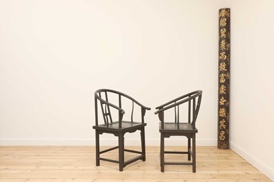 Lot 469 - A pair of Chinese style ebonised softwood armchairs