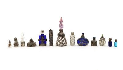 Lot 69 - A collection of white metal mounted scent bottles