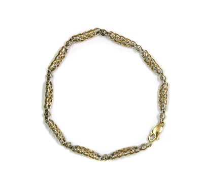 Lot 1099 - A 9ct two colour gold diamond set bracelet