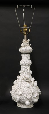 Lot 211 - A Continental porcelain floral-encrusted vase lamp