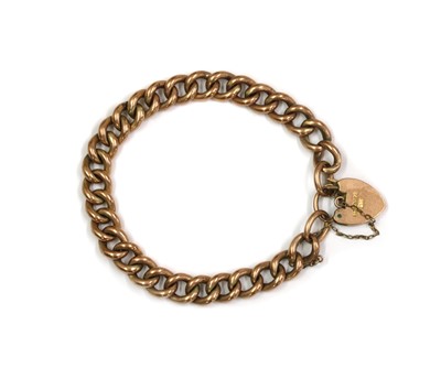 Lot 1410 - A gold hollow curb link bracelet