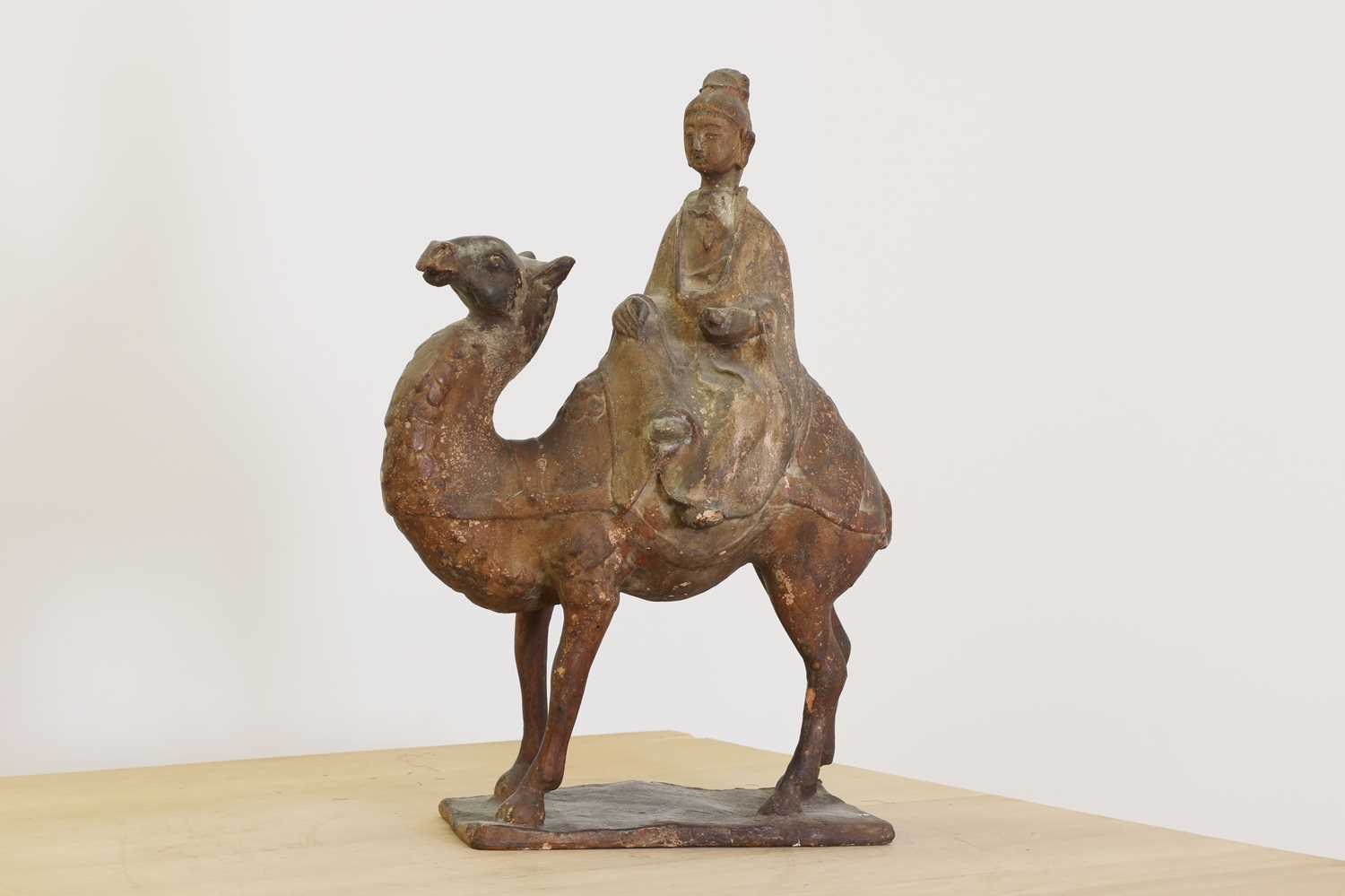 Lot 239 - A Chinese Tang-style pottery figure of a camel and rider