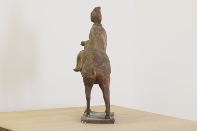 Lot 239 - A Chinese Tang-style pottery figure of a camel and rider