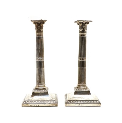 Lot 12 - A pair of George III silver candlesticks