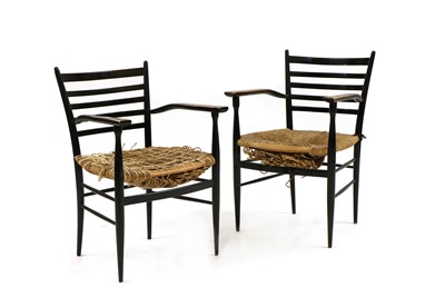 Lot 380 - A pair of ebonised Italian armchairs