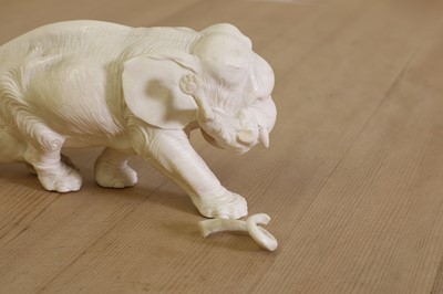 Lot 179 - A Japanese carved ivory elephant and lion group