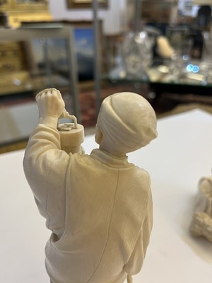 Lot 155 - A Japanese solid carved ivory figure of a man