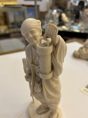 Lot 155 - A Japanese solid carved ivory figure of a man