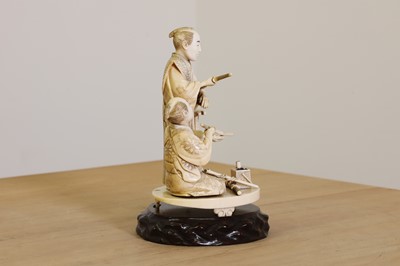 Lot 169 - A Japanese sectional carved ivory okimono