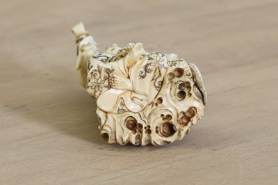 Lot 166 - A Japanese carved ivory okimono