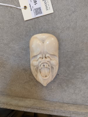 Lot 165 - A Japanese carved ivory mask