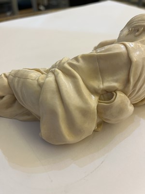 Lot 161 - A Japanese carved ivory figure of a lady asleep