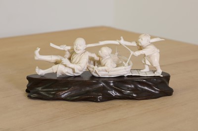 Lot 160 - A Japanese carved ivory group