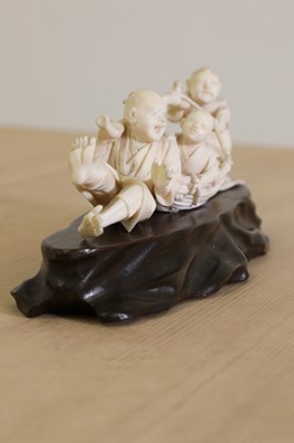 Lot 160 - A Japanese carved ivory group