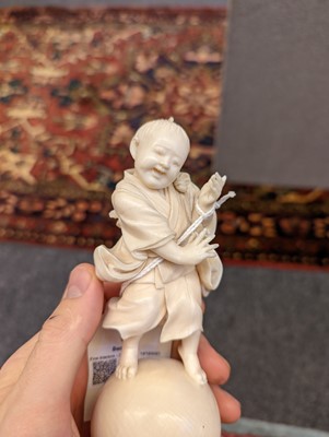 Lot 158 - A Japanese carved ivory figure of a child