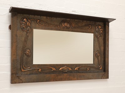 Lot 141 - An Art Nouveau copper mirror