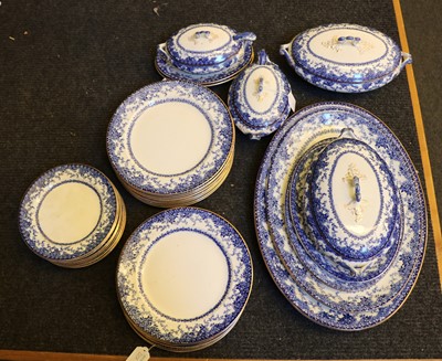 Lot 220 - A blue and white pottery dinner service