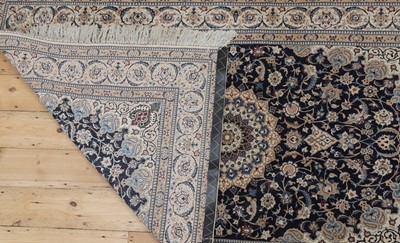 Lot 286 - A Persian wool and silk rug