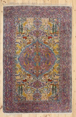 Lot 777 - A Persian wool rug with silk highlights