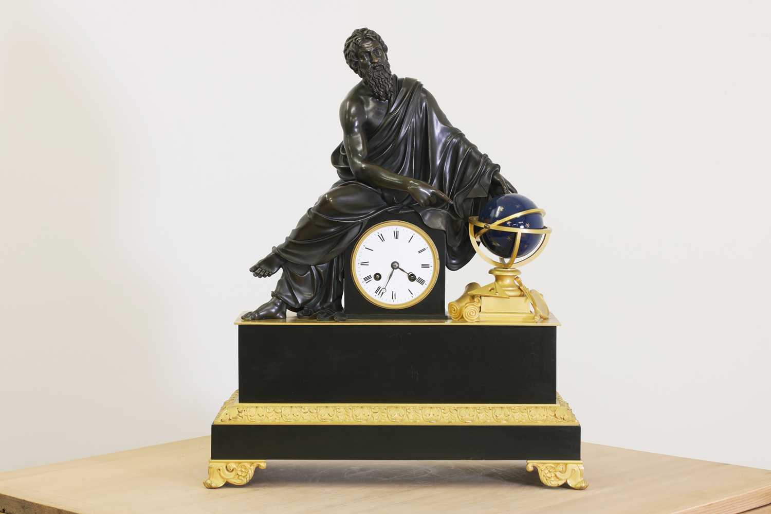 Lot 198 - An Empire-style patinated and gilt-bronze mantel clock