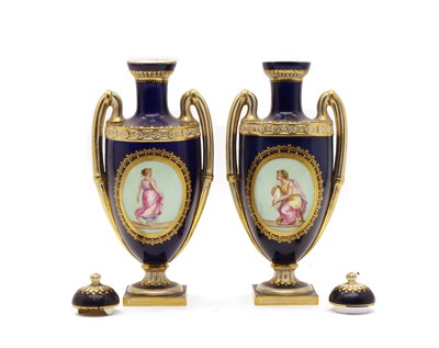 Lot 256 - A pair of late 19th century Royal Vienna style twin handled lidded vases