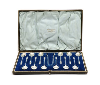 Lot 10 - A set of twelve silver apostle spoons and sugar tong set