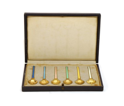Lot 32 - A set of six silver gilt and enamel coffee spoons