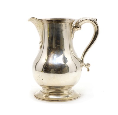 Lot 1 - A silver baluster form water jug