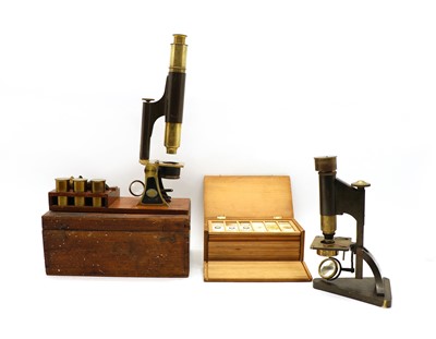 Lot 339 - A brass and black painted iron compound microscope