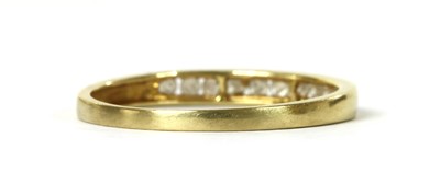 Lot 1105 - An 18ct gold diamond half eternity ring